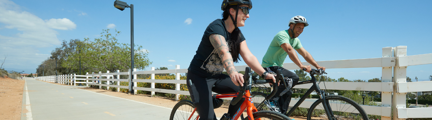 two people riding bikes on the Pacific Electric Trail