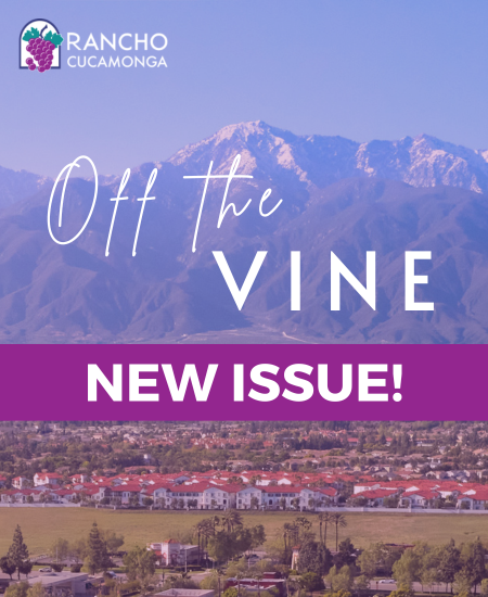 Illustration of the mountains and neighborhood with the text Off the Vine New Issue! on the front along with the City of Rancho Cucamonga logo with grapes and purple arch.