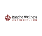 Logo featuring a maroon emblem shaped like two stylized hands surrounding a central figure. To the right of the emblem, the text reads 'Rancho Wellness' in maroon letters, with the tagline 'Your Medical Home' displayed beneath.