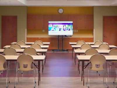 Meeting space at Central Park set up with multiple chairs classroom style. 
