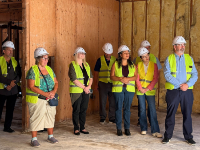 Westside Library Expansion Project Construction Kickoff Ceremony with Library Board members with hard hats and safety vests
