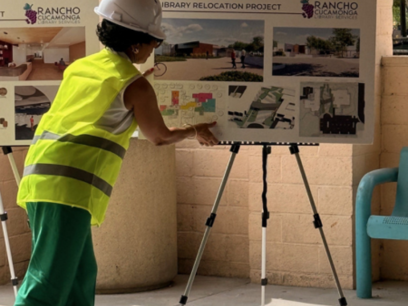 Westside Library Expansion Project Construction photo with building renderings